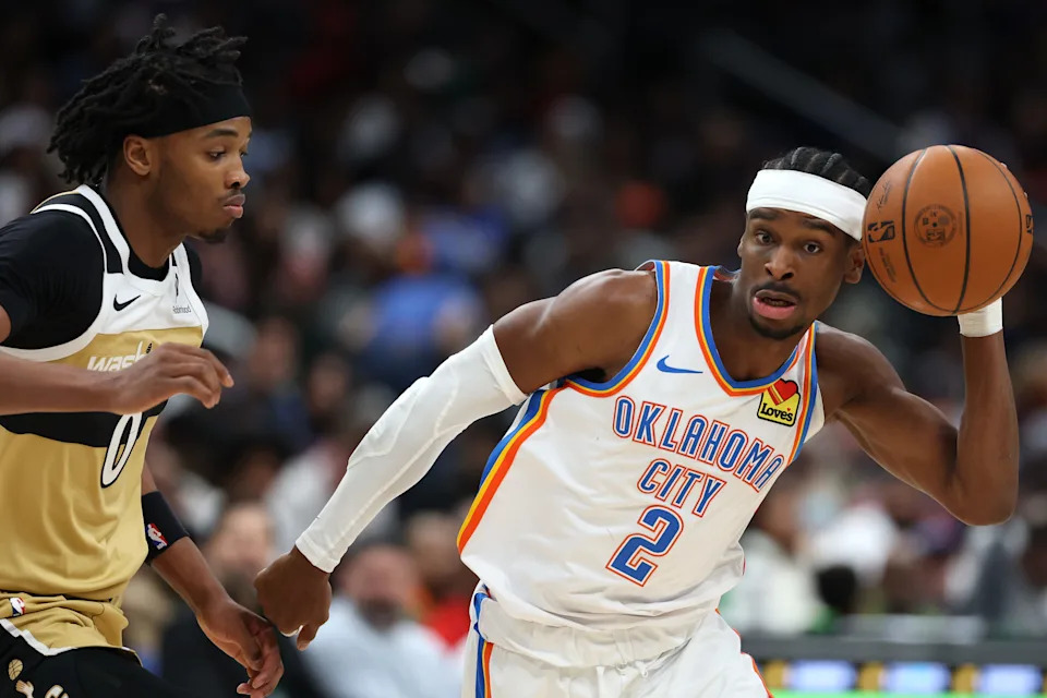 WASHINGTON, DC - MARCH 21: Shai Gilgeous-Alexander #2 of the Oklahoma City Thunder dribbles past Bilal Coulibaly #0 of the Washington Wizards during the first half at Capital One Arena on March 21, 2026 in Washington, DC. NOTE TO USER: User expressly acknowledges and agrees that, by downloading and or using this photograph, User is consenting to the terms and conditions of the Getty Images License Agreement. (Photo by Patrick Smith/Getty Images)