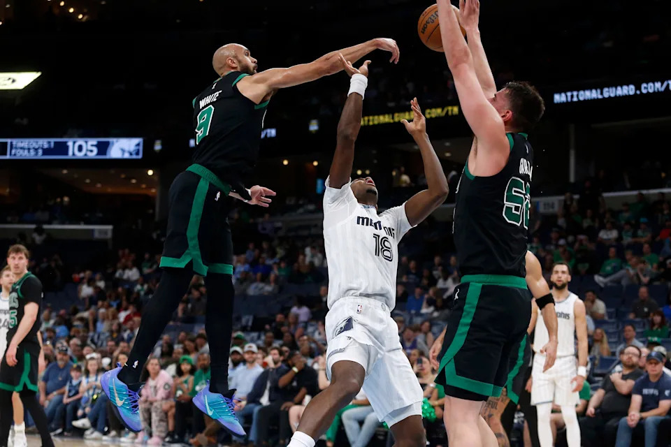 Mar 20, 2026; Memphis, Tennessee, USA; Boston Celtics guard Derrick White (9) blocks a shot attempt by Memphis Grizzlies forward Olivier-Maxence Prosper (18) during the fourth quarter at FedExForum. Mandatory Credit: Petre Thomas-Imagn Images