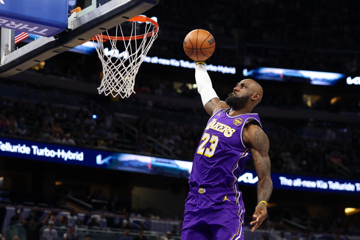 Los Angeles Lakers forward LeBron James (23) drives to the basket against the Orlando Magic in the first quarter at Kia Center.Nathan Ray Seebeck-Imagn Images