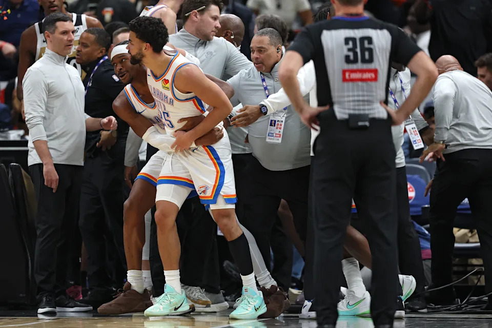 WASHINGTON, DC - MARCH 21: Ajay Mitchell #25 of the Oklahoma City Thunder is pulled out of a scrum of players by teammate Shai Gilgeous-Alexander #2 during the first half at Capital One Arena on March 21, 2026 in Washington, DC. Ajay Mitchell #25 of the Oklahoma City Thunder received a double technical and ejected from the contest. NOTE TO USER: User expressly acknowledges and agrees that, by downloading and or using this photograph, User is consenting to the terms and conditions of the Getty Images License Agreement. (Photo by Patrick Smith/Getty Images)