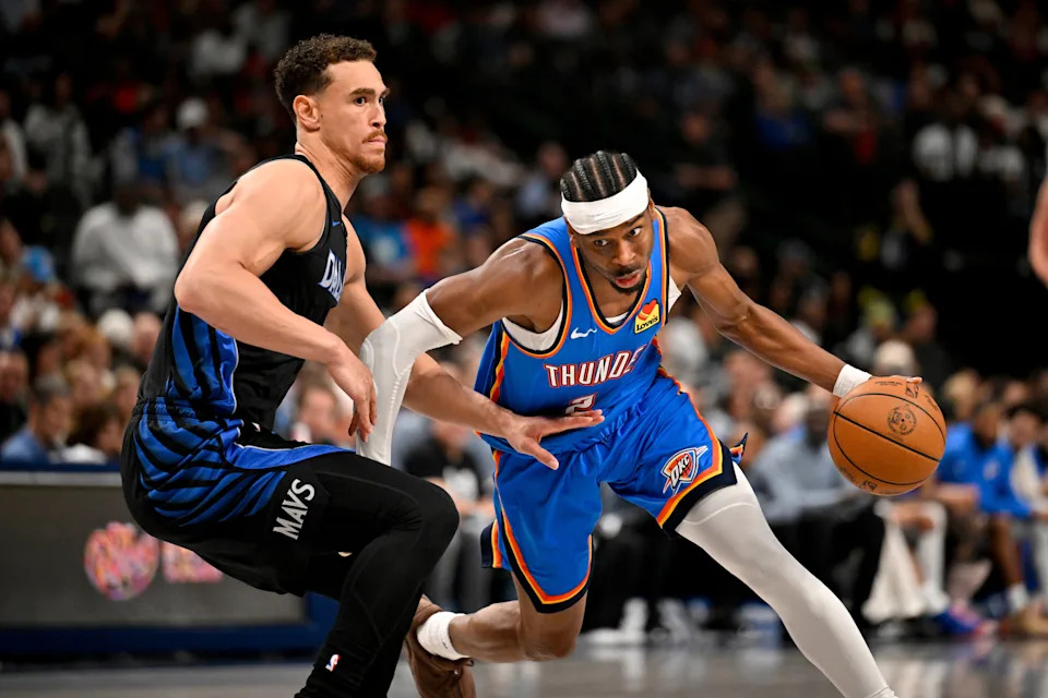 Mar 1, 2026; Dallas, Texas, USA; Oklahoma City Thunder guard Shai Gilgeous-Alexander (2) drives to the basket past Dallas Mavericks forward Dwight Powell (7) during the second half at the American Airlines Center. Mandatory Credit: Jerome Miron-Imagn Images