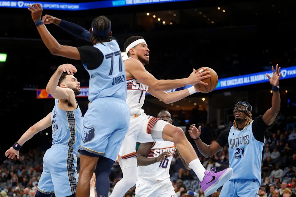 Phoenix Suns guard Devin Booker (1) drives to the basket against the Memphis Grizzlies during the second quarter at FedExForum on March 30, 2026.