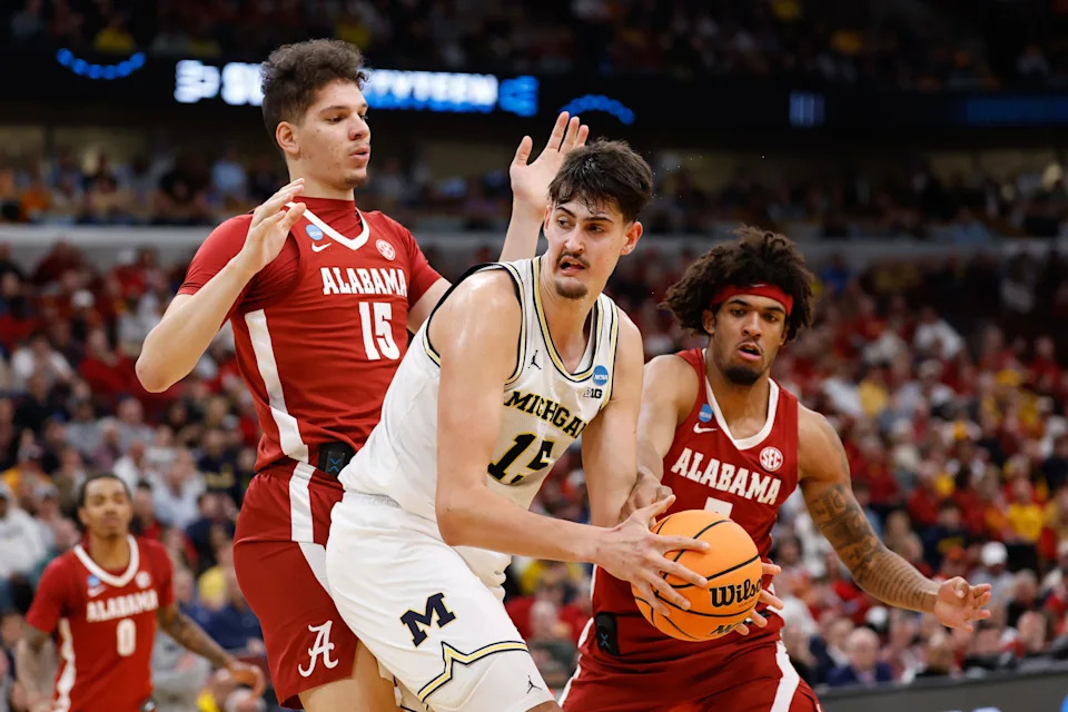 Mar 27, 2026; Chicago, IL, USA; Michigan Wolverines center Aday Mara (15) is double teamed by Alabama Crimson Tide center Noah Williamson (15) and forward Amari Allen (5) in the second half during a Sweet Sixteen game of the Midwest Regional of the men's 2026 NCAA Tournament at United Center. Mandatory Credit: Kamil Krzaczynski-Imagn Images