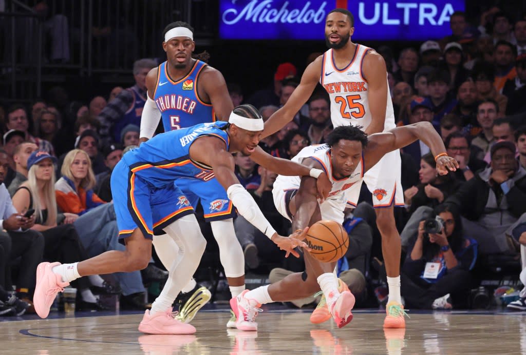 OG Anunoby (right) and Shai Gilgeous-Alexander battle for a loose ball. Charles Wenzelberg / New York Post