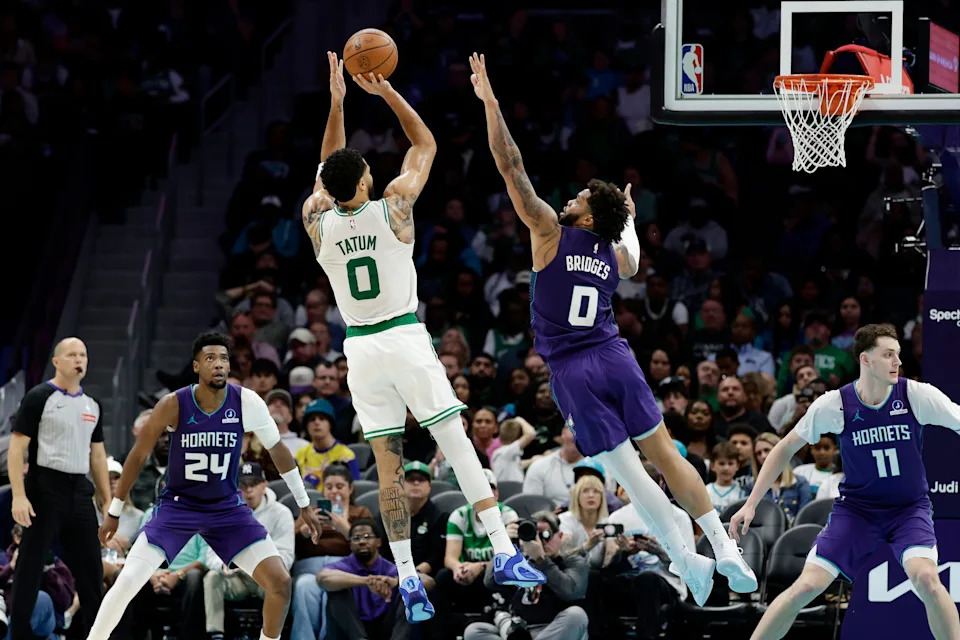 Mar 29, 2026; Charlotte, North Carolina, USA; Boston Celtics forward/guard Jayson Tatum (0) shoots over Charlotte Hornets forward Miles Bridges (0) during the second half at Spectrum Center. Mandatory Credit: Brian Westerholt-Imagn Images