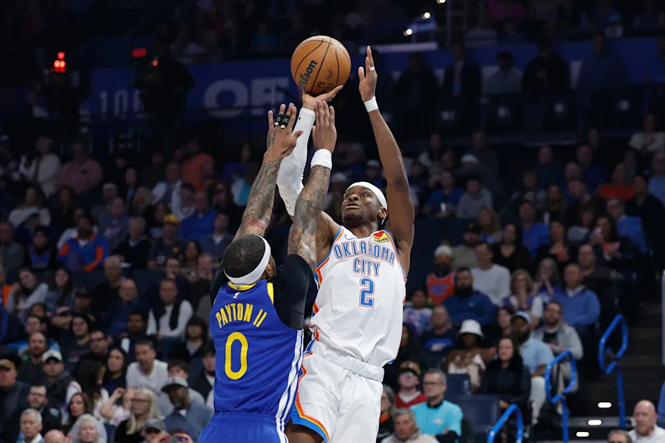 Mar 7, 2026; Oklahoma City, Oklahoma, USA; Oklahoma City Thunder guard Shai Gilgeous-Alexander (2) shoots as Golden State Warriors guard Gary Payton II (0) defends during the first half at Paycom Center. Mandatory Credit: Alonzo Adams-Imagn Images