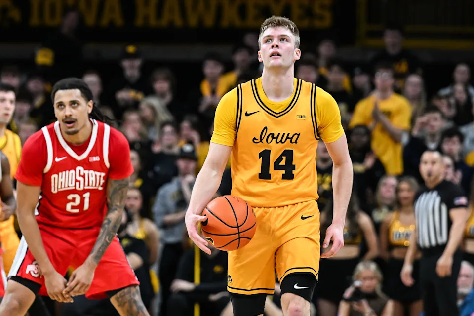 Feb 25, 2026; Iowa City, Iowa, USA; Iowa Hawkeyes guard Bennett Stirtz (14) reacts after being fouled by Ohio State Buckeyes forward Devin Royal (21) during the first half at Carver-Hawkeye Arena. Mandatory Credit: Jeffrey Becker-Imagn Images
