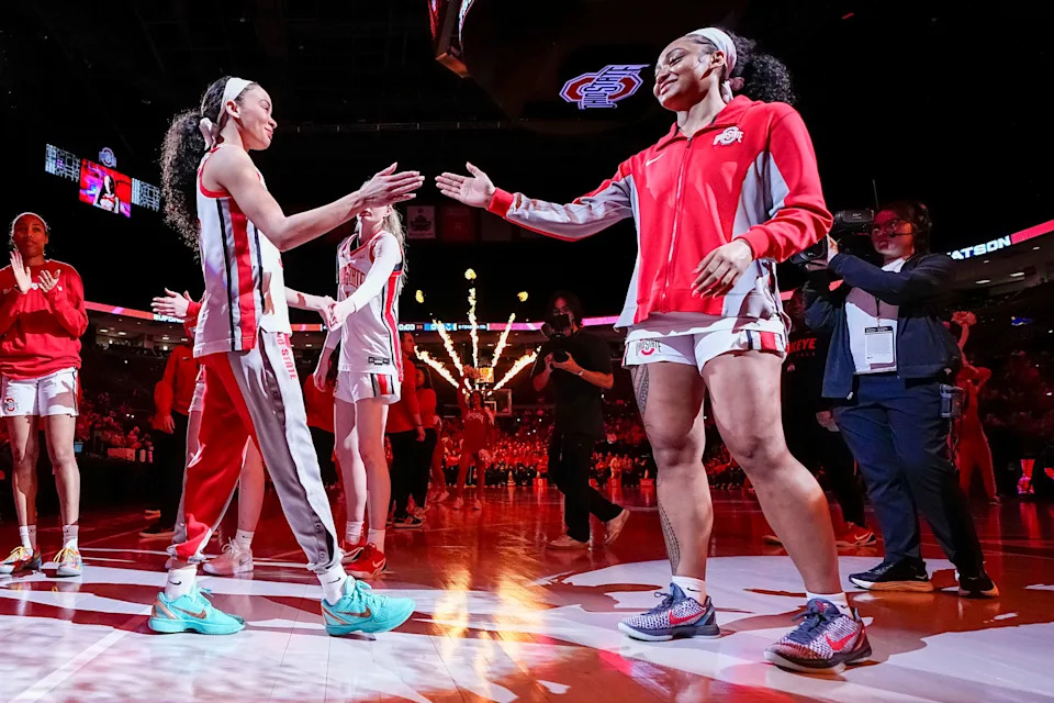 Ohio State guard Ava Watson (left) is introduced before the Buckeyes' 88-86 overtime loss to Michigan on Feb. 25.