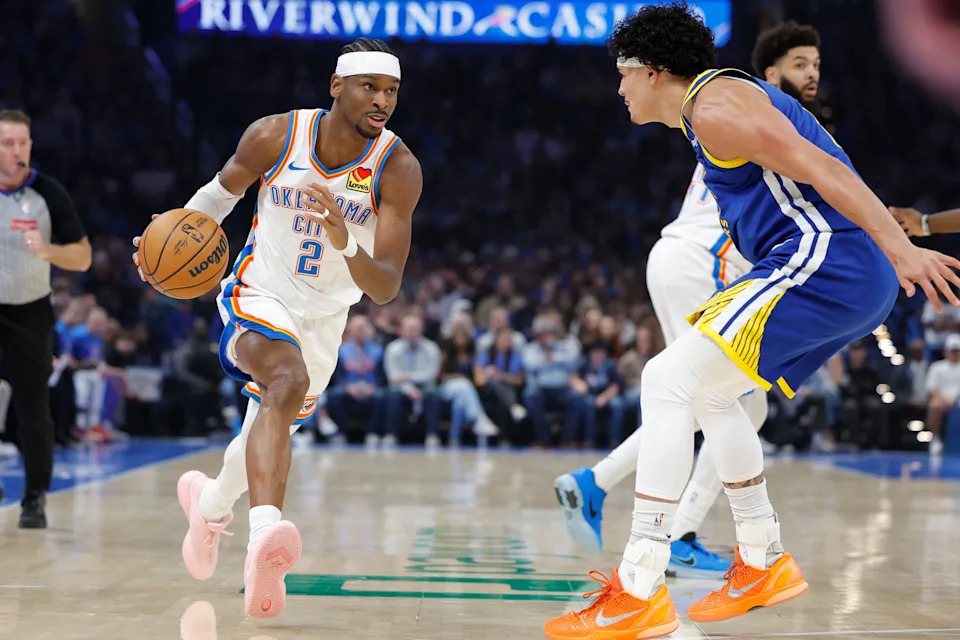 Mar 7, 2026; Oklahoma City, Oklahoma, USA; Oklahoma City Thunder guard Shai Gilgeous-Alexander (2) dribbles the ball down the court beside Golden State Warriors forward Gui Santos (15) during the first half at Paycom Center. Mandatory Credit: Alonzo Adams-Imagn Images
