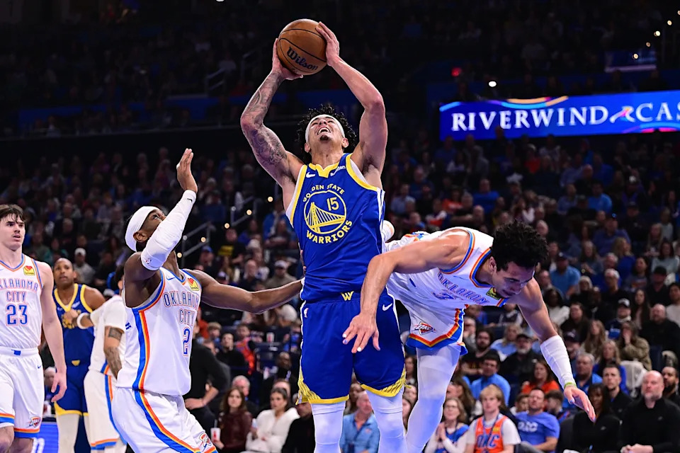 OKLAHOMA CITY, OKLAHOMA - MARCH 7: Gui Santos #15 of the Golden State Warriors attempts a shot in front of Shai Gilgeous-Alexander #2 and Jared McCain #3 of the Oklahoma City Thunder during the first half at Paycom Center on March 7, 2026 in Oklahoma City, Oklahoma. NOTE TO USER: User expressly acknowledges and agrees that, by downloading and or using this photograph, User is consenting to the terms and conditions of the Getty Images License Agreement. (Photo by Joshua Gateley/Getty Images)