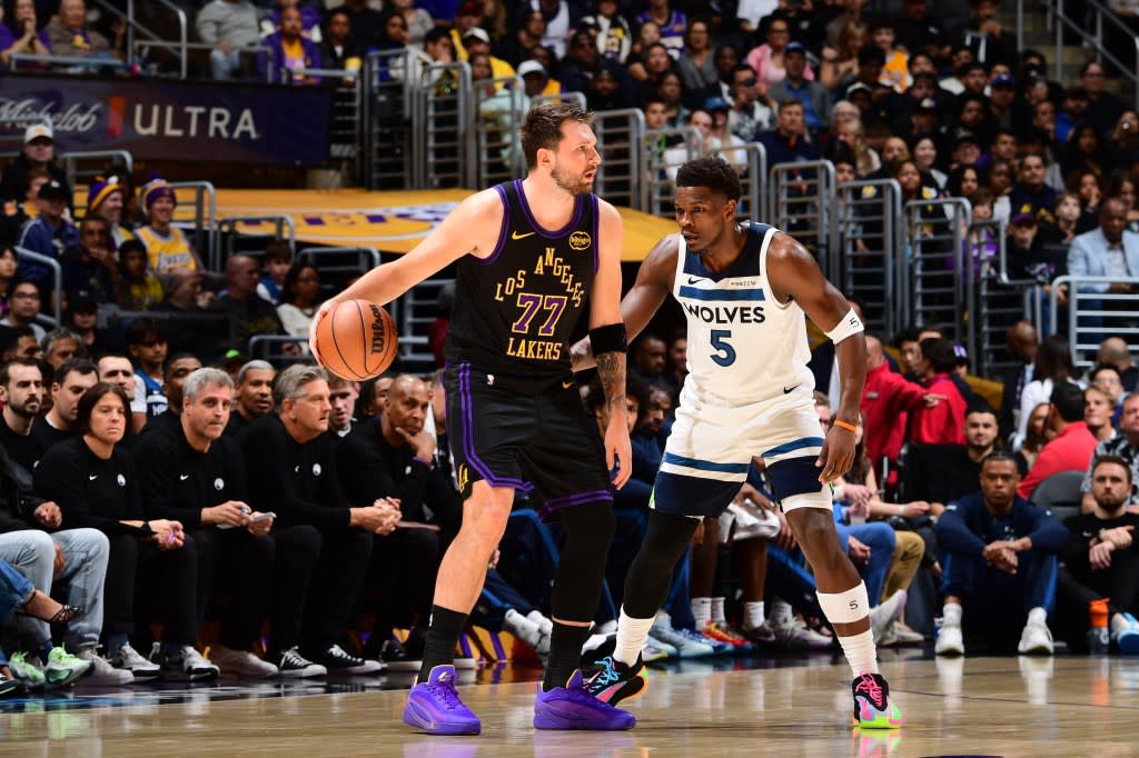 Luka Doncic of the Los Angeles Lakers is guarded by Anthony Edwards of the Minnesota Timberwolves during the game on March 10, 2026 at Crypto.Com Arena in Los Angeles, California. NBAE via Getty Images
