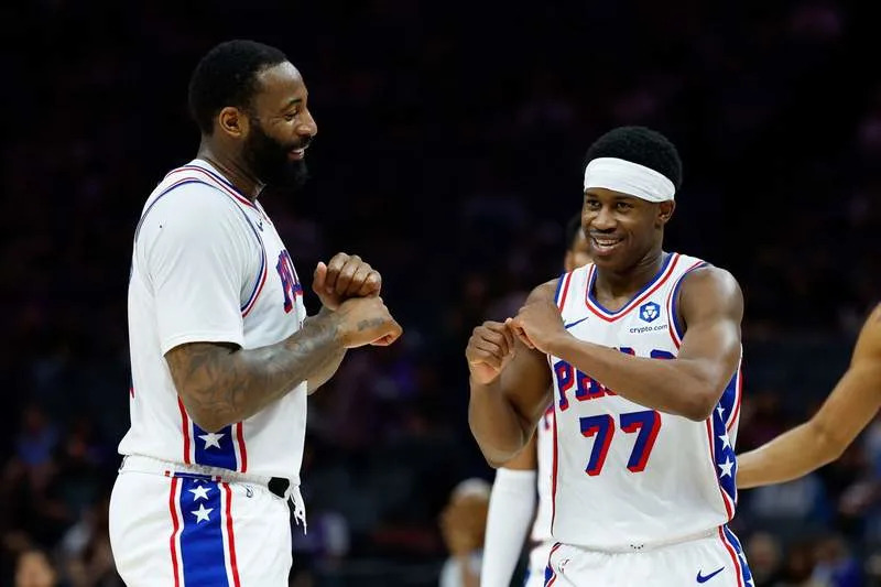 Mar 19, 2026; Sacramento, California, USA; Philadelphia 76ers guard Vj Edgecombe (77) celebrates with center Andre Drummond (1) during the fourth quarter against the Sacramento Kings at Golden 1 Center. Mandatory Credit: Sergio Estrada-Imagn Images