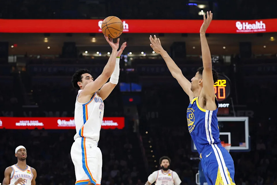 Mar 7, 2026; Oklahoma City, Oklahoma, USA; Oklahoma City Thunder guard Jared McCain (3) shoots a three point basket as Golden State Warriors forward Malevy Leons (33) defends during the first half at Paycom Center. Mandatory Credit: Alonzo Adams-Imagn Images