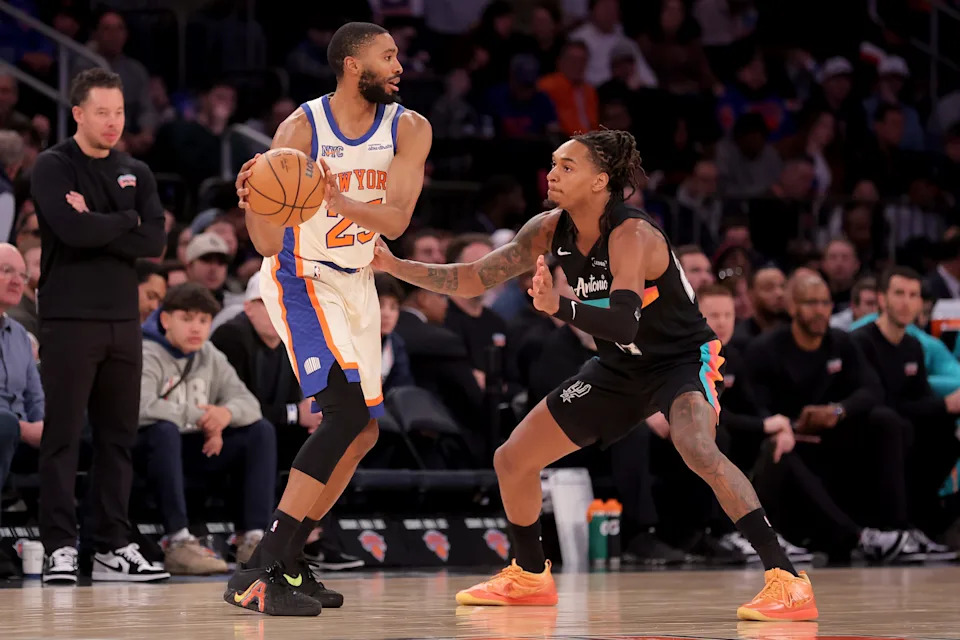 Mar 1, 2026; New York, New York, USA; New York Knicks guard Mikal Bridges (25) controls the ball against San Antonio Spurs guard Devin Vassell (24) during the third quarter at Madison Square Garden. Mandatory Credit: Brad Penner-Imagn Images
