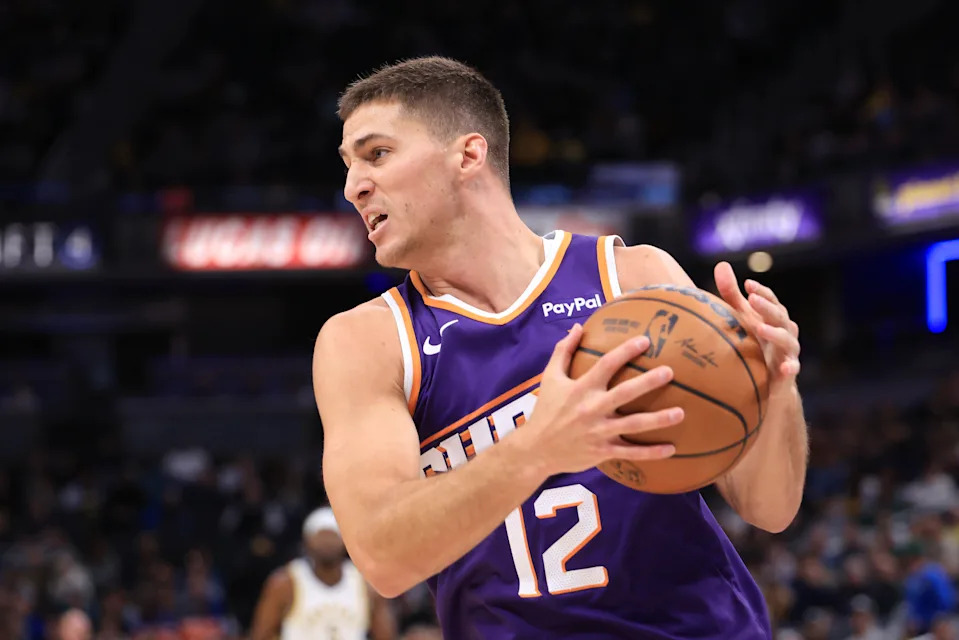INDIANAPOLIS, INDIANA – MARCH 12: Collin Gillespie #12 of the Phoenix Suns rebounds the ball against the Indiana Pacers at Gainbridge Fieldhouse on March 12, 2026 in Indianapolis, Indiana. NOTE TO USER: User expressly acknowledges and agrees that, by downloading and or using this photograph, User is consenting to the terms and conditions of the Getty Images License Agreement. (Photo by Justin Casterline/Getty Images) | Getty Images