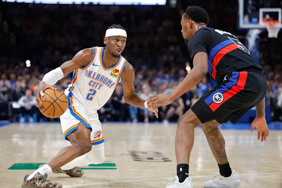 Mar 30, 2026; Oklahoma City, Oklahoma, USA; Oklahoma City Thunder guard Shai Gilgeous-Alexander (2) drives against Detroit Pistons forward Ronald Holland II (5) during the second half at Paycom Center. Mandatory Credit: Alonzo Adams-Imagn Images