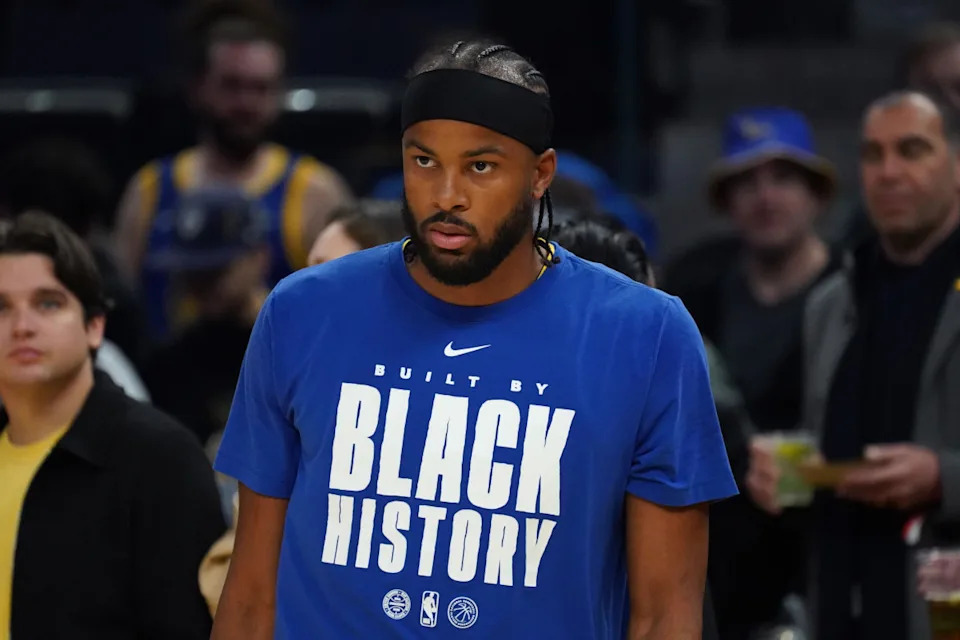 Golden State Warriors guard Moses Moody (4) warms up wearing a Black History t-shirt before the game against the Denver Nuggets at Chase Center.<br> © David Gonzales-Imagn Images