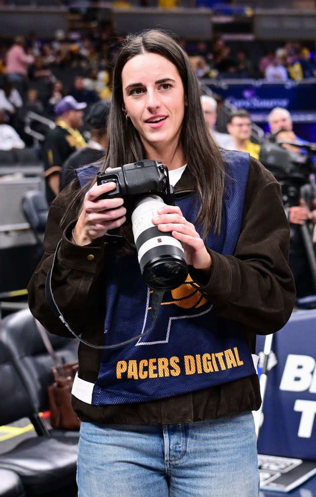Clark appeared to be taking a picture of Lakers star Luka Dončić. IMAGN IMAGES via Reuters Connect