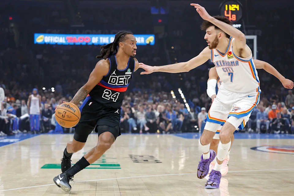 Mar 30, 2026; Oklahoma City, Oklahoma, USA; Detroit Pistons guard Daniss Jenkins (24) drives around Oklahoma City Thunder center Chet Holmgren (7) during the first quarter at Paycom Center. Mandatory Credit: Alonzo Adams-Imagn Images