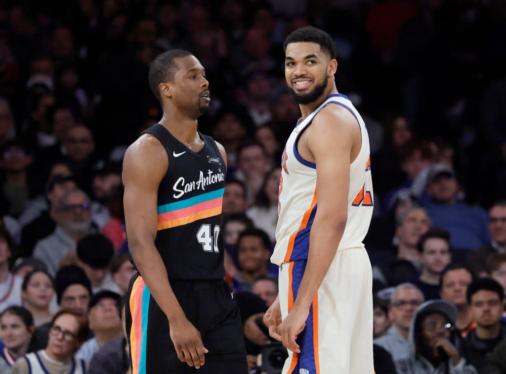 Karl-Anthony Towns is all smiles in front of San Antonio Spurs forward Harrison Barnes during the fourth quarter at Madison Square Garden on Sunday, March 1, 2026. JASON SZENES FOR THE NEW YORK POST