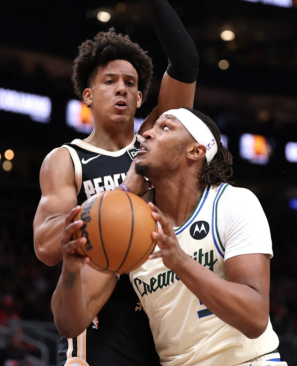 ATLANTA, GEORGIA - JANUARY 19: Myles Turner #3 of the Milwaukee Bucks drives against Jalen Johnson #1 of the Atlanta Hawks during the second quarter at State Farm Arena on January 19, 2026 in Atlanta, Georgia. NOTE TO USER: User expressly acknowledges and agrees that, by downloading and or using this photograph, User is consenting to the terms and conditions of the Getty Images License Agreement. (Photo by Kevin C. Cox/Getty Images)