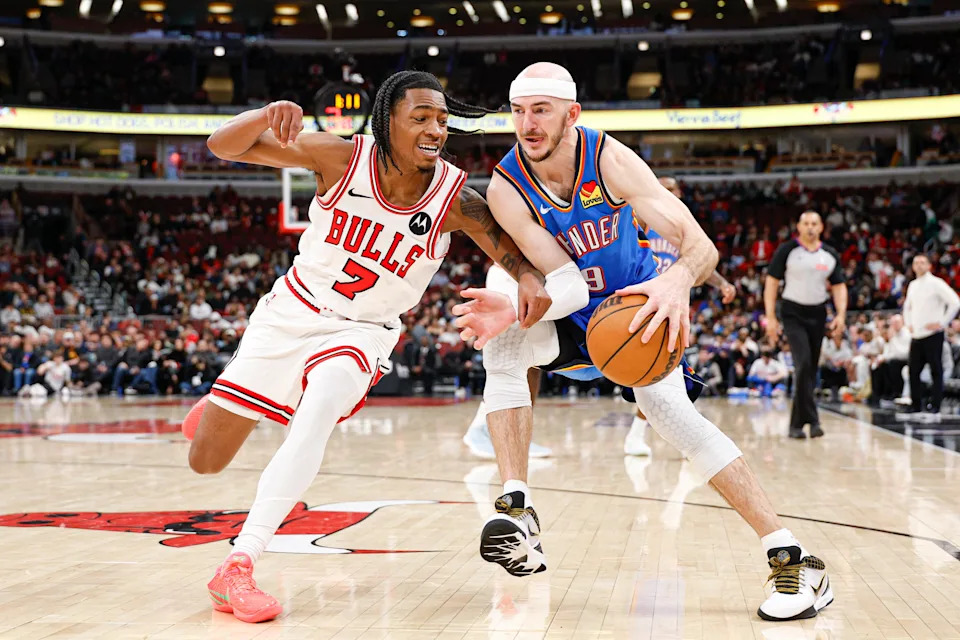 Mar 3, 2026; Chicago, Illinois, USA; Chicago Bulls guard Rob
Dillingham (7) defends against Oklahoma City Thunder guard Alex Caruso (9) during the second half at United Center. Mandatory Credit: Kamil Krzaczynski-Imagn Images