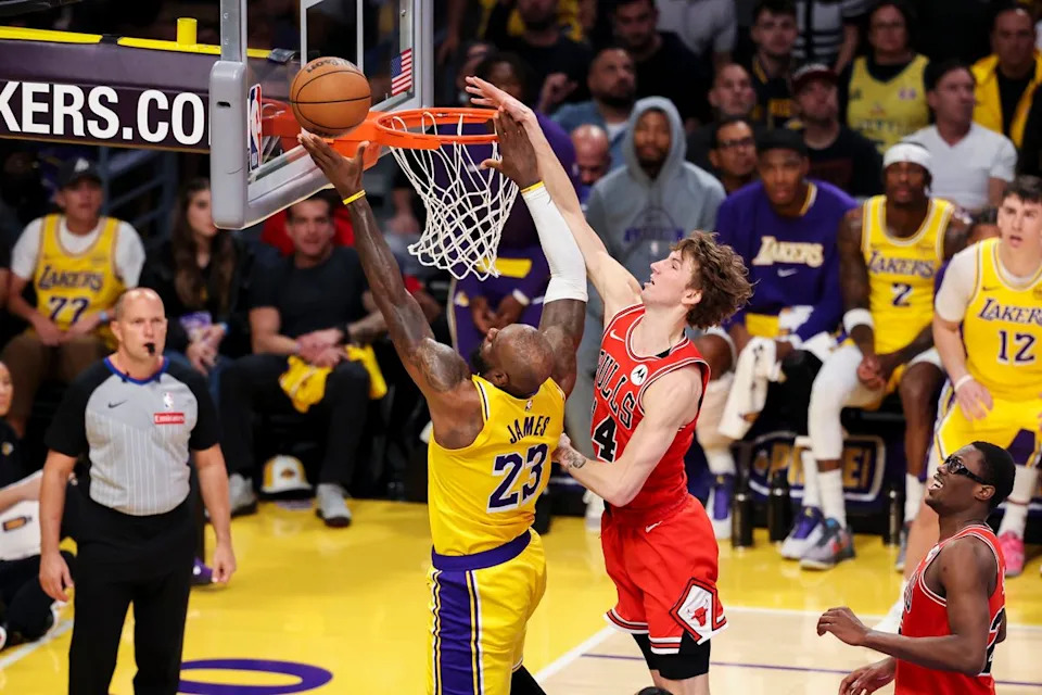 LeBron James #23 of the Los Angeles Lakers lays the ball up past Matas Buzelis #14 of the Chicago Bulls during an NBA basketball game, Thursday March 12, 2026 in Los Angeles, Calif.