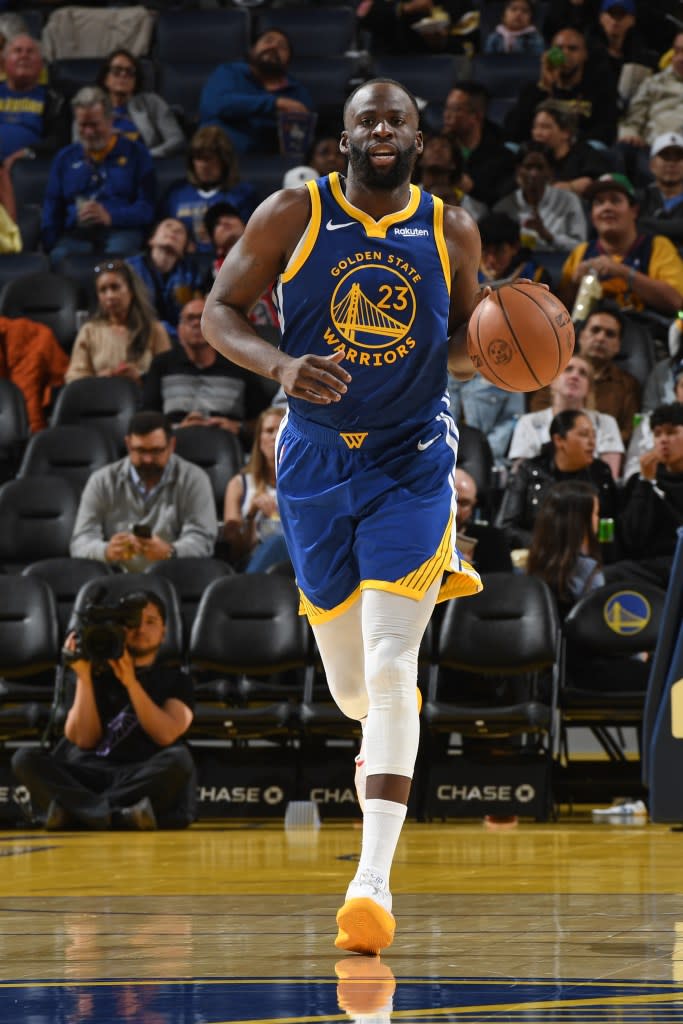 Draymond Green dribbling the basketball during a game. NBAE via Getty Images
