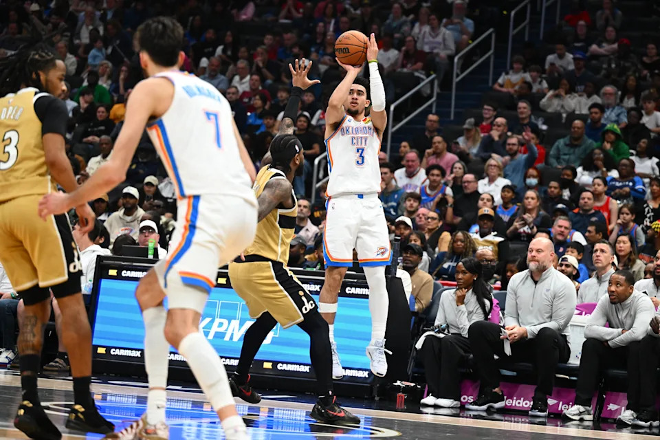 Mar 21, 2026; Washington, District of Columbia, USA; Oklahoma City Thunder guard Jared McCain (3) over Washington Wizards center Alex Sarr (20) during the second half at Capital One Arena. Mandatory Credit: Brad Mills-Imagn Images