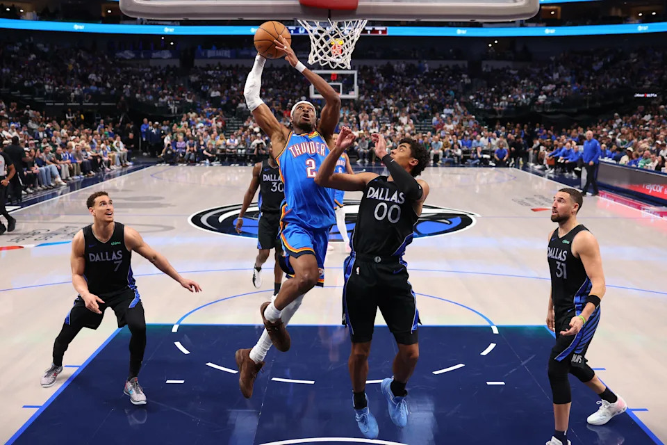 DALLAS, TEXAS - MARCH 01: Shai Gilgeous-Alexander #2 of the Oklahoma City Thunder makes a move to the basket against Max Christie #00 of the Dallas Mavericks during the second quarter at American Airlines Center on March 01, 2026 in Dallas, Texas. NOTE TO USER: User expressly acknowledges and agrees that, by downloading and or using this photograph, user is consenting to the terms and conditions of the Getty Images License Agreement. (Photo by Sam Hodde/Getty Images)