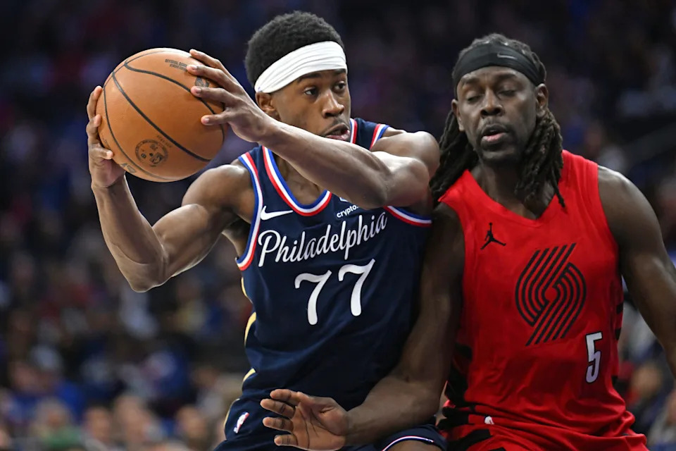 Mar 15, 2026; Philadelphia, Pennsylvania, USA; Philadelphia 76ers guard Vj Edgecombe (77) drives to the basket agains Portland Trail Blazers guard Jrue Holiday (5) during the second half at Xfinity Mobile Arena. Mandatory Credit: Eric Hartline-Imagn Images
