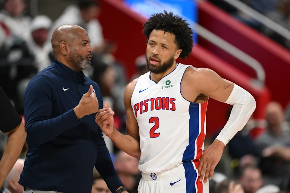 Mar 12, 2026; Detroit, Michigan, USA; Detroit Pistons head coach J.B. Bickerstaff talks with Pistons guard Cade Cunningham (2) during a break in the action against the Philadelphia 76ers in the first half at Little Caesars Arena. Mandatory Credit: Lon Horwedel-Imagn Images