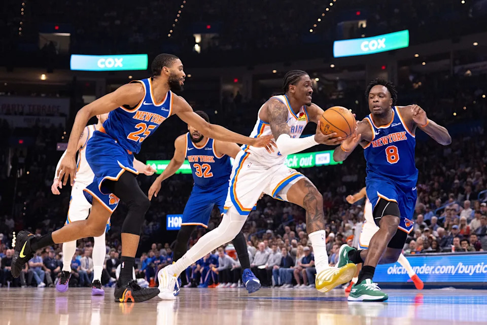 OKLAHOMA CITY, OKLAHOMA - MARCH 29: Jalen Williams #8 of the Oklahoma City Thunder drives to the basket around Og Anunoby #8 of the New York Knicks during the first half at Paycom Center on March 29, 2026 in Oklahoma City, Oklahoma. NOTE TO USER: User expressly acknowledges and agrees that, by downloading and or using this photograph, User is consenting to the terms and conditions of the Getty Images License Agreement. (Photo by William Purnell/Getty Images)