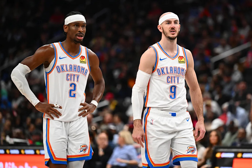 Mar 21, 2026; Washington, District of Columbia, USA; Oklahoma City Thunder guard Shai Gilgeous-Alexander (2) and guard Alex Caruso (9) talk against the Washington Wizards during the second half at Capital One Arena. Mandatory Credit: Brad Mills-Imagn Images