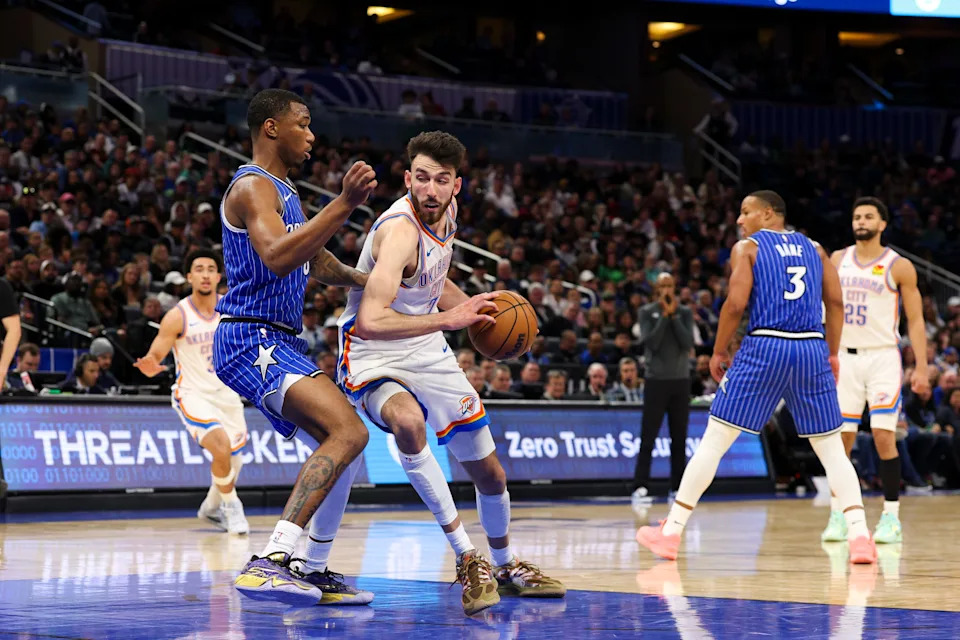 Mar 17, 2026; Orlando, Florida, USA; Oklahoma City Thunder center Chet Holmgren (7) is guarded by Orlando Magic forward Jamal Cain (8) in the fourth quarter at Kia Center. Mandatory Credit: Nathan Ray Seebeck-Imagn Images