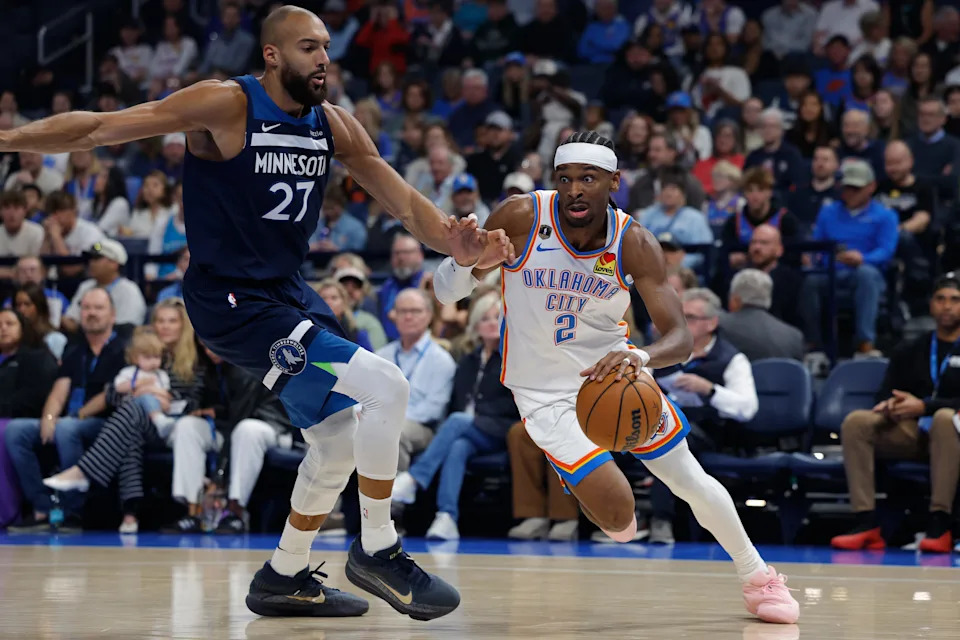 Mar 15, 2026; Oklahoma City, Oklahoma, USA; Oklahoma City Thunder guard Shai Gilgeous-Alexander (2) drives around Minnesota Timberwolves center Rudy Gobert (27) during the first half at Paycom Center. Mandatory Credit: Alonzo Adams-Imagn Images