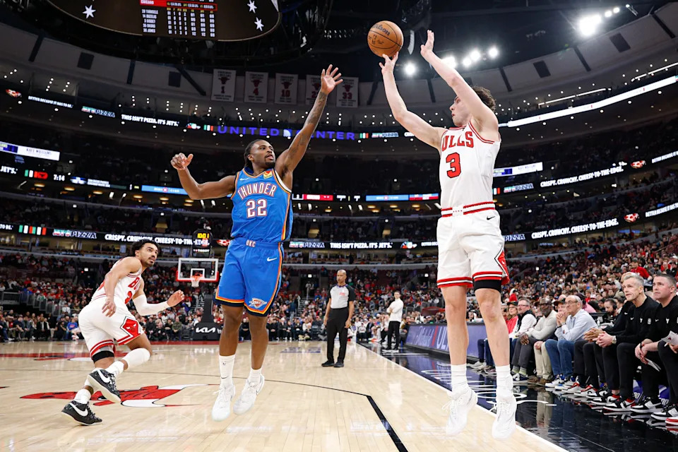 Mar 3, 2026; Chicago, Illinois, USA; Chicago Bulls guard Josh Giddey (3) shoots against Oklahoma City Thunder guard Cason Wallace (22) during the first half at United Center. Mandatory Credit: Kamil Krzaczynski-Imagn Images