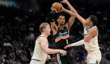 Victor Wembanyama of the San Antonio Spurs trying to get past the Milwaukee Bucks in the third quarter at Fiserv Forum.