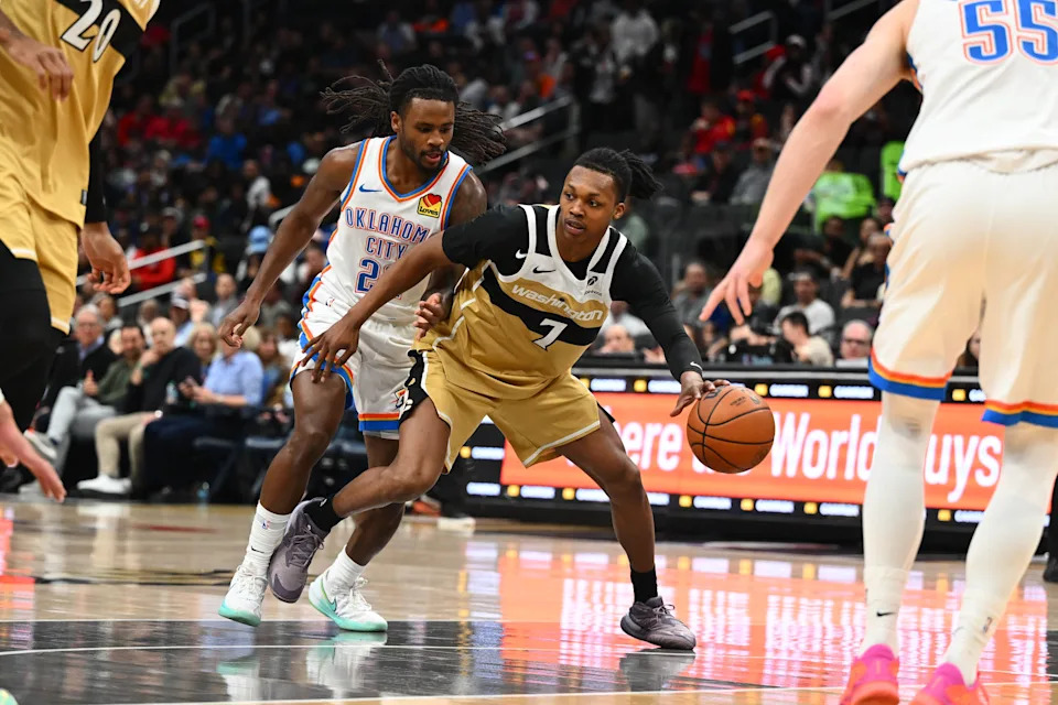 Mar 21, 2026; Washington, District of Columbia, USA; Washington Wizards guard Bub Carrington (7) dribbles as Oklahoma City Thunder guard Cason Wallace (22) defends during the first half at Capital One Arena. Mandatory Credit: Brad Mills-Imagn Images