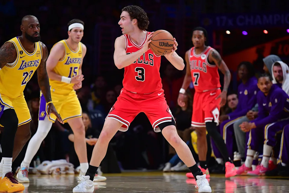 Mar 12, 2026; Los Angeles, California, USA; Chicago Bulls guard Josh Giddey (3) controls the ball against Los Angeles Lakers forward LeBron James (23) during the first half at Crypto.com Arena. Mandatory Credit: Gary A. Vasquez-Imagn Images