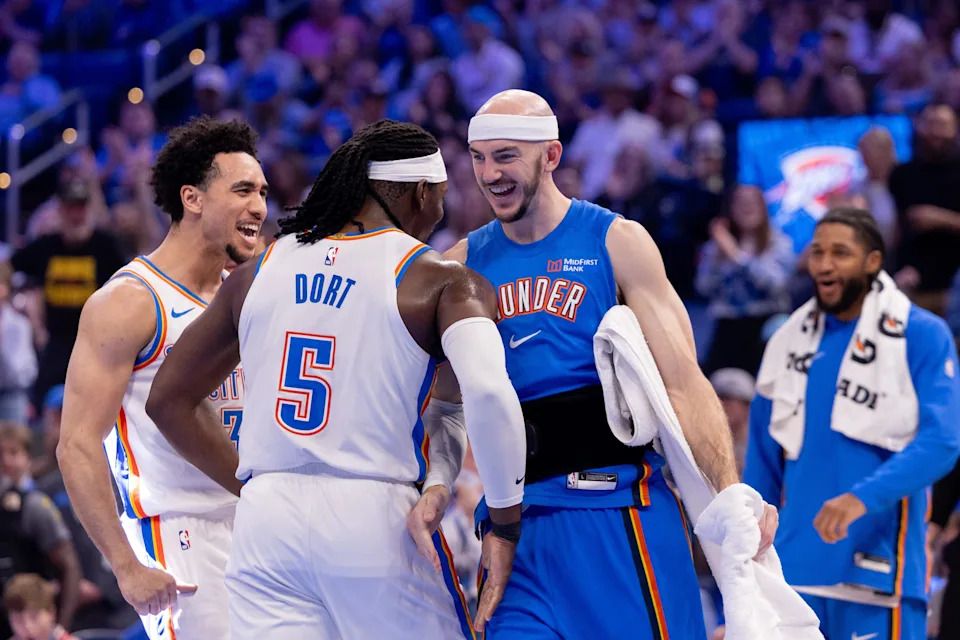 OKLAHOMA CITY, OKLAHOMA - MARCH 29: Luguentz Dort #5 of the Oklahoma City Thunder, Jared McCain #3 of the Oklahoma City Thunder and Alex Caruso #9 of the Oklahoma City Thunder react after a play during the first half against the New York Knicks at Paycom Center on March 29, 2026 in Oklahoma City, Oklahoma. NOTE TO USER: User expressly acknowledges and agrees that, by downloading and or using this photograph, User is consenting to the terms and conditions of the Getty Images License Agreement. (Photo by William Purnell/Getty Images)