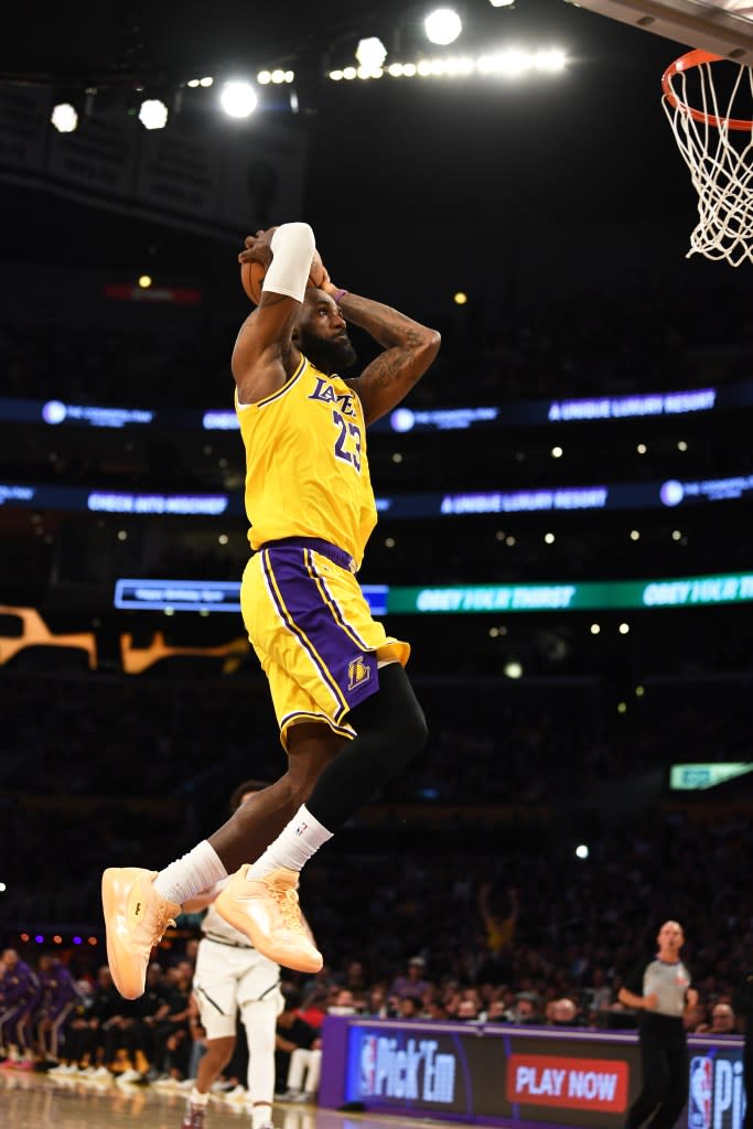 LeBron James of the Los Angeles Lakers dunks the ball during the game against the Denver Nuggets on March 14, 2026 at Crypto.Com Arena in Los Angeles, California. (Photo by Nick Tomoyasu/NBAE via Getty Images) NBAE via Getty Images