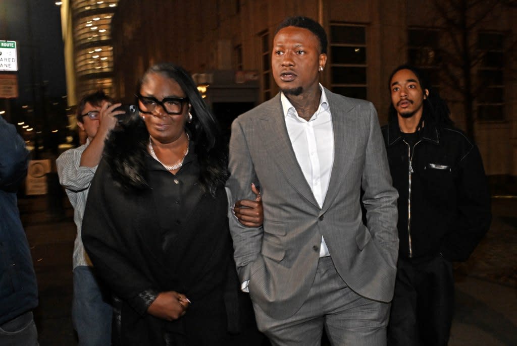 Terry Rozier (pictured, gray suit) leaves court after his status hearing for his gambling case on Monday, December 8th. He has been charged with crimes related to gambling. At the US Federal Courthouse for the Eastern District of New York, 225 Cadman Plaza East, Brooklyn, NY. Gregory P. Mango