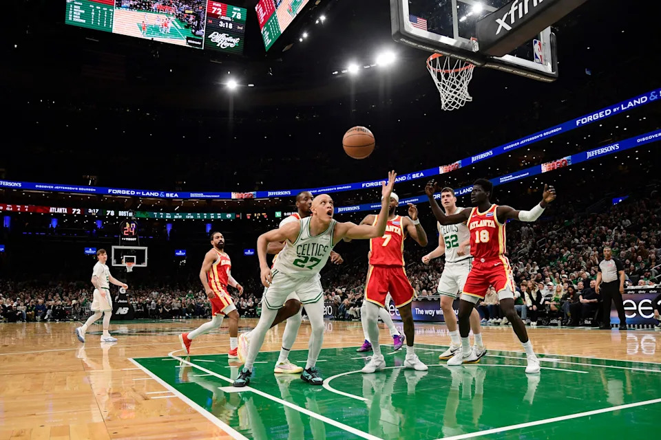 Mar 27, 2026; Boston, Massachusetts, USA; Boston Celtics guard Jordan Walsh (27) tries to gain control of the ball in front of Atlanta Hawks guard Nickeil Alexander-Walker (7) and forward Mouhamed Gueye (18) during the second half at TD Garden. Mandatory Credit: Bob DeChiara-Imagn Images