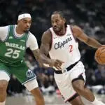 LA Clippers forward Kawhi Leonard (2) drives to the basket past Dallas Mavericks forward P.J. Washington (25) during the first quarter at the American Airlines Center on Mar 21, 2026.