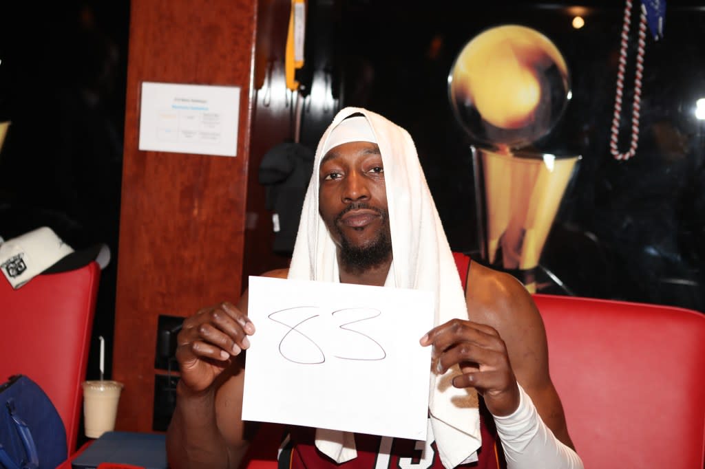 Bam Adebayo poses for a photo holding up a sign after scoring 83 points against the Washington Wizards. NBAE via Getty Images