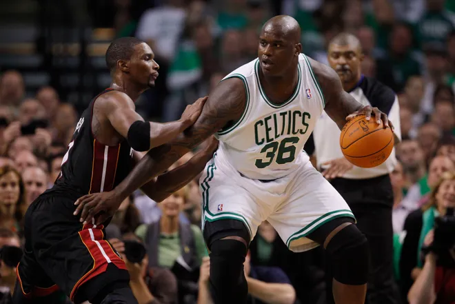 Oct 26, 2010; Boston, MA, USA; Boston Celtics center Shaquille O'Neal (36) works the ball during the second half against Miami Heat power forward Chris Bosh (left) at the TD Garden. The Celtics defeated Miami 88-80. Mandatory Credit: David Butler II-USA TODAY Sports