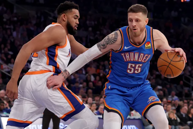 Jan 10, 2025; New York, New York, USA; Oklahoma City Thunder center Isaiah Hartenstein (55) controls the ball against New York Knicks center Karl-Anthony Towns (32) during the first quarter at Madison Square Garden. Mandatory Credit: Brad Penner-Imagn Images