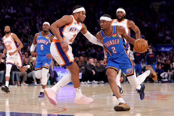 Jan 10, 2025; New York, New York, USA; Oklahoma City Thunder guard Shai Gilgeous-Alexander (2) drives to the basket against New York Knicks guard Miles McBride (2) and forward Precious Achiuwa (5) during the first quarter at Madison Square Garden. Mandatory Credit: Brad Penner-Imagn Images