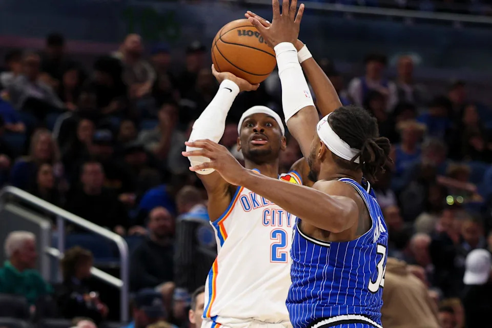 Mar 17, 2026; Orlando, Florida, USA; Oklahoma City Thunder guard Shai Gilgeous-Alexander (2) shoots the ball over Orlando Magic center Wendell Carter Jr. (34) in the third quarter at Kia Center. Mandatory Credit: Nathan Ray Seebeck-Imagn Images